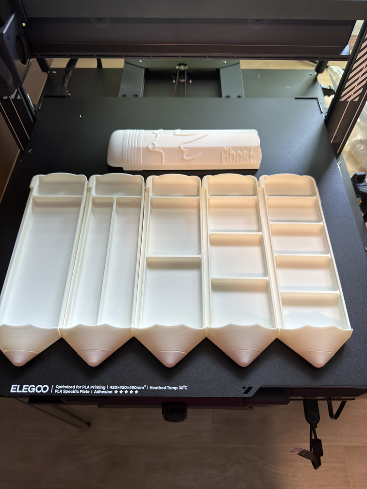 5 interior layout options and ghost lid prototype fresh off the Elegoo print bed